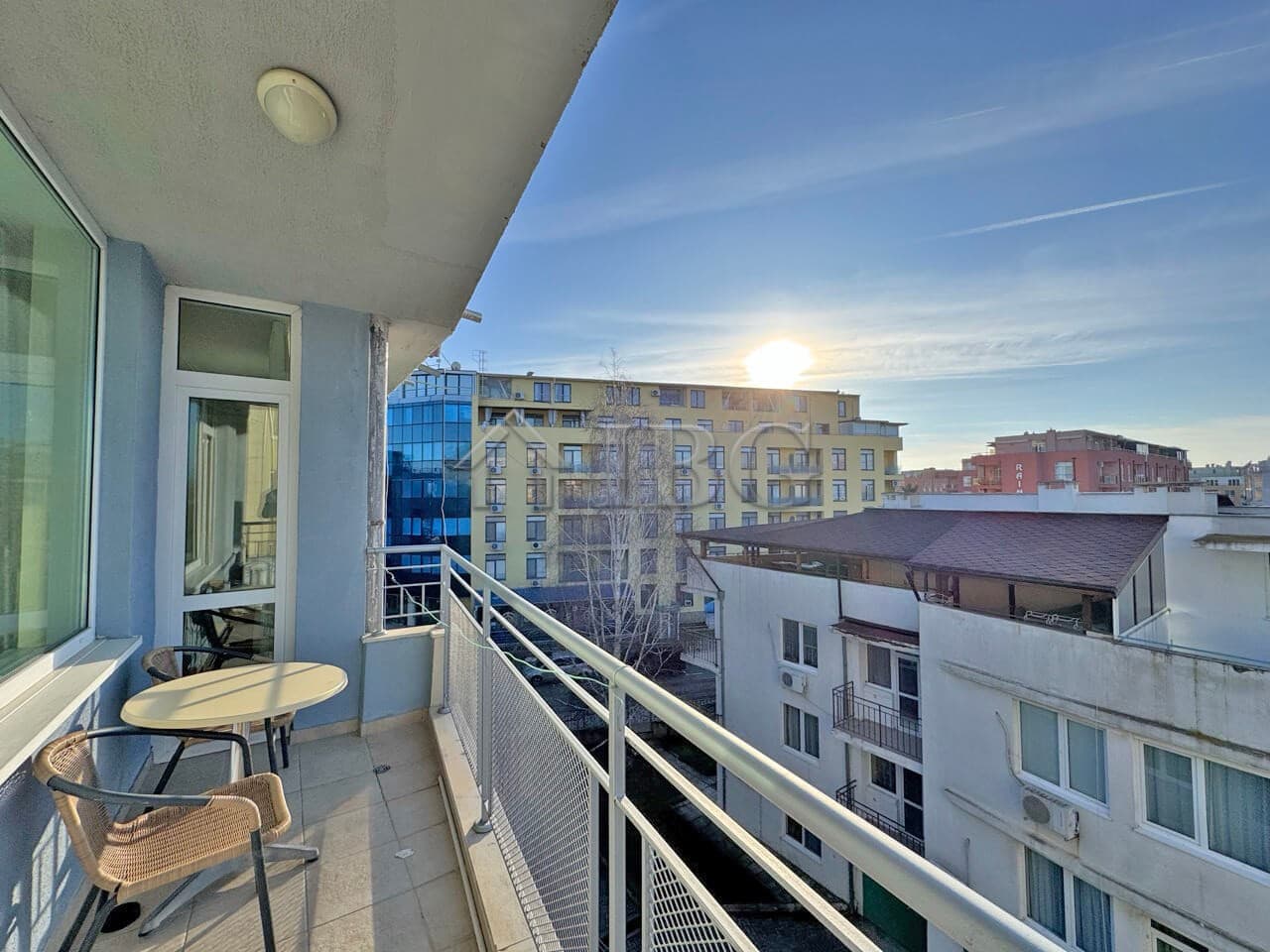 Bright balcony view of Sunny Beach cityscape with modern buildings and clear sky.