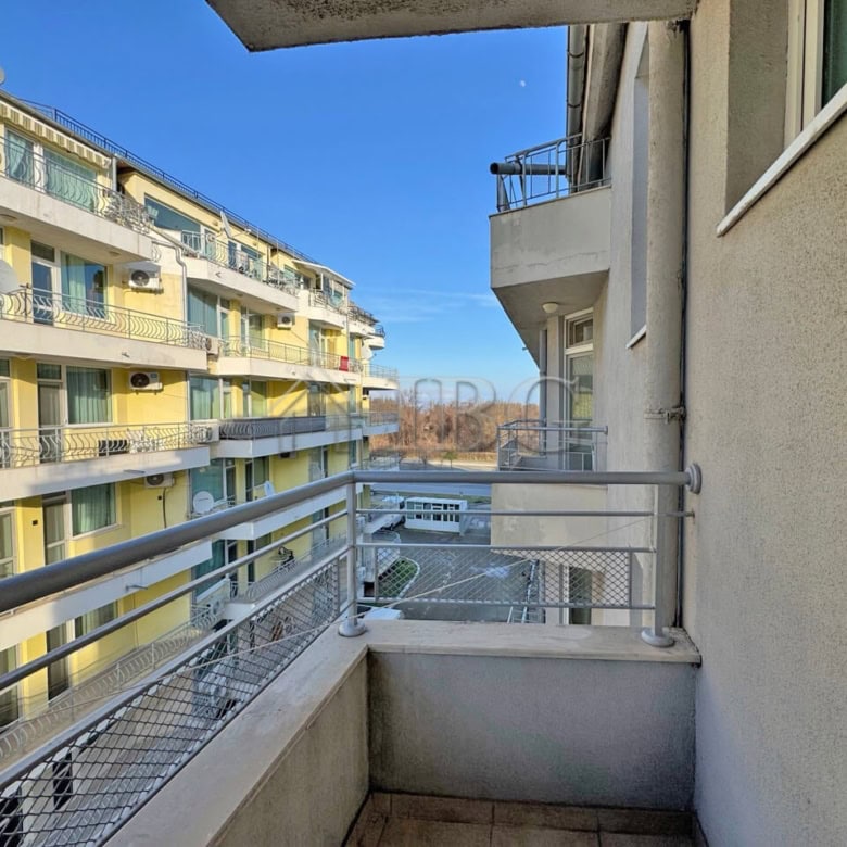 Balcony of a 1-bedroom apartment at Apart Hotel Favorit, Sunny Beach, showcasing modern building fac.