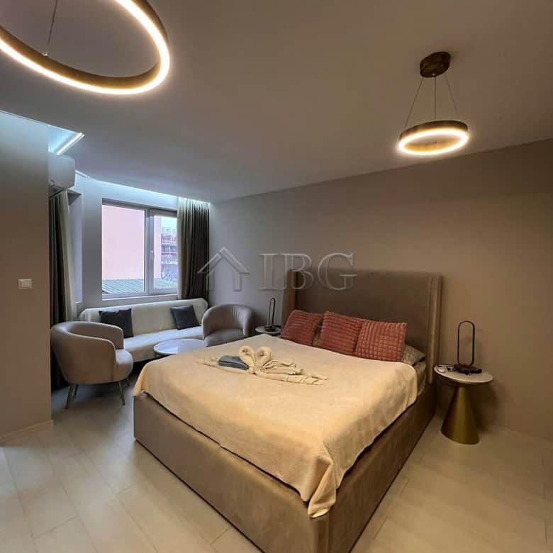 Stylish studio with balcony, modern furnishings, and natural light in a new complex at Sunny Beach.