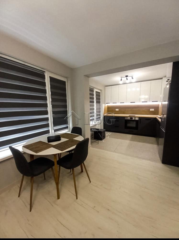 Furnished 1-bedroom apartment in Ruse city center, ideal for rent, featuring a cozy dining area and.
