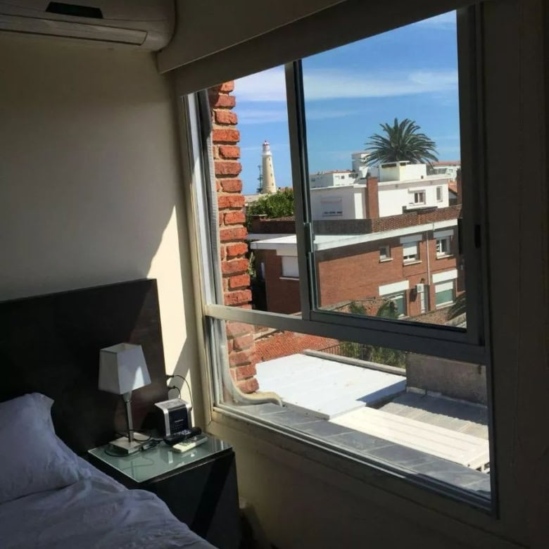 Bedroom overlooking Punta del Este skyline and ocean.