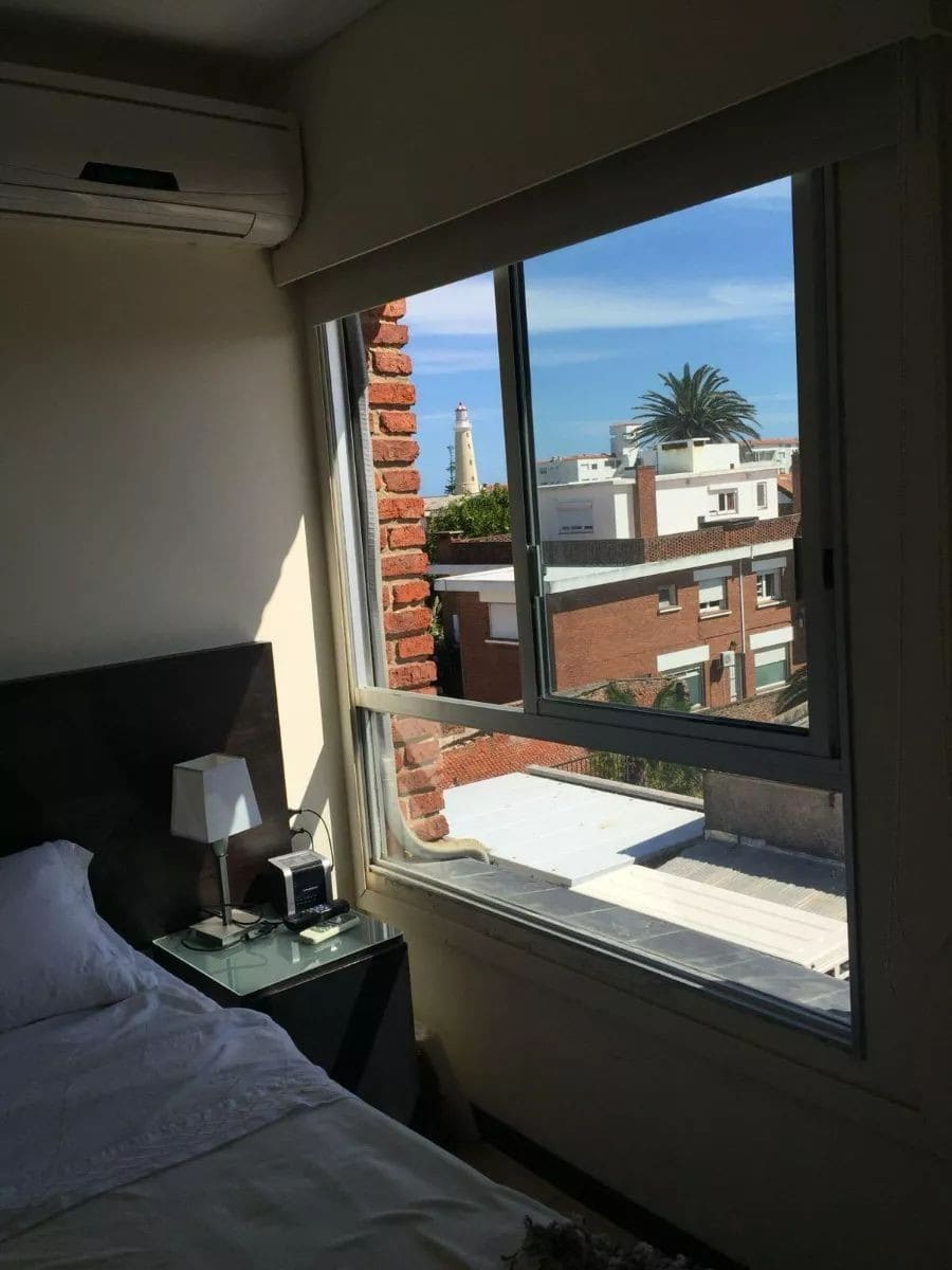 Bedroom overlooking Punta del Este skyline and ocean.