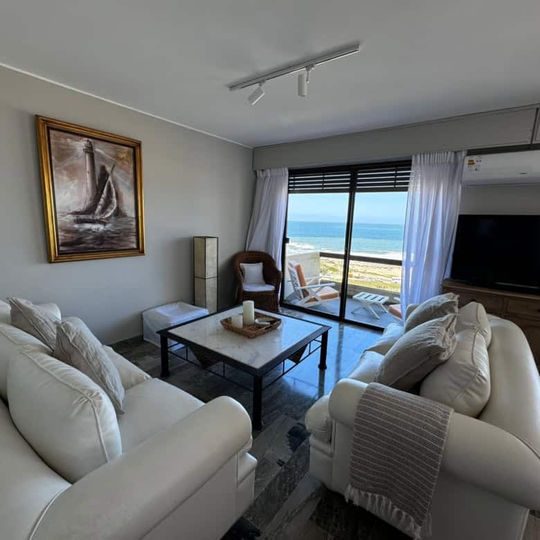 Modern living room with sea view in Punta del Este apartment.