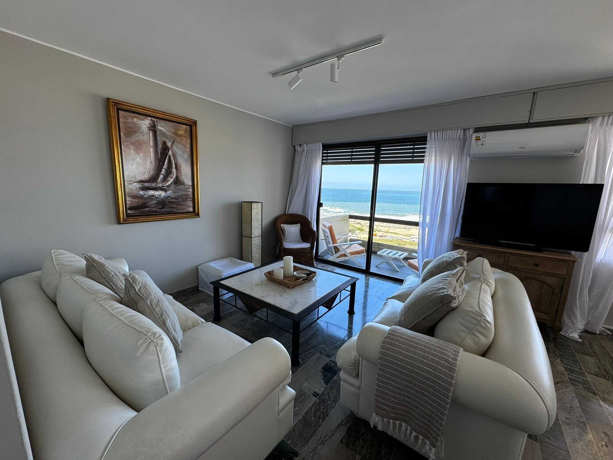 Modern living room with sea view in Punta del Este apartment.