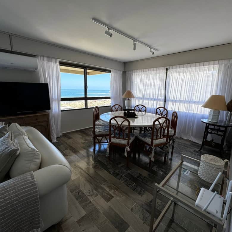 Spacious living room with large windows overlooking the ocean in Punta del Este, Maldonado. Perfect.