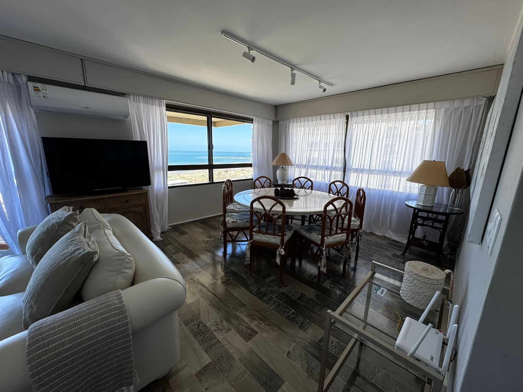 Spacious living room with large windows overlooking the ocean in Punta del Este, Maldonado. Perfect.