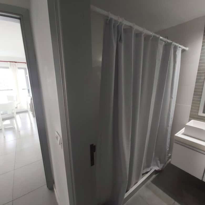 Apartment bathroom with shower and vanity in Punta del Este, Maldonado, Uruguay.