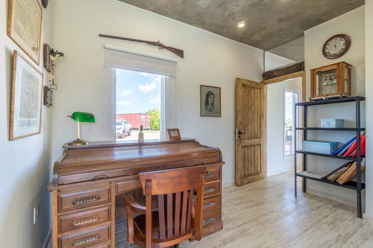 Cozy interior of a country house in Punta Ballena, Maldonado, featuring wooden furniture, a large wi.