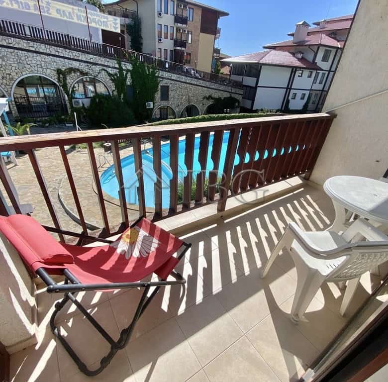 Bright balcony with pool view in Sveti Vlas, Etara 1. Perfect for relaxing and enjoying outdoor spac.