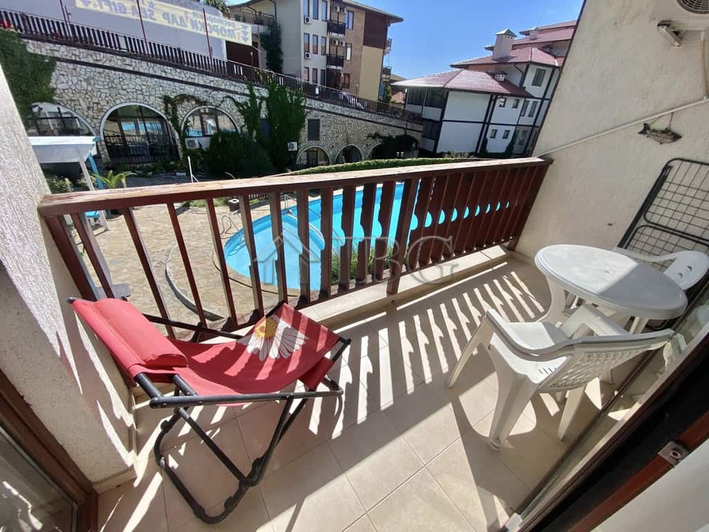 Bright balcony with pool view in Sveti Vlas, Etara 1. Perfect for relaxing and enjoying outdoor spac.