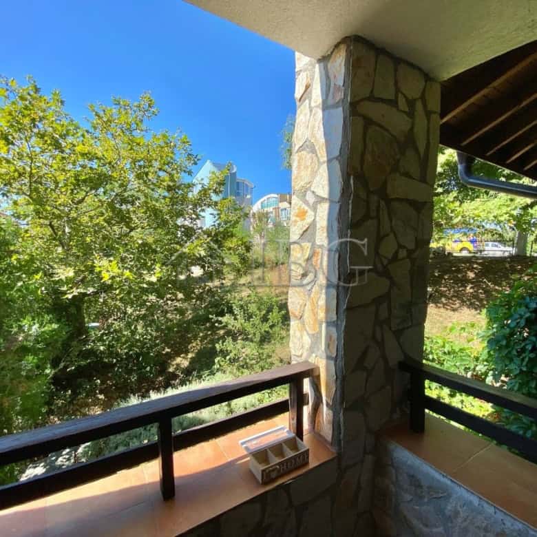 Bright balcony overlooking lush greenery in Sveti Vlas.