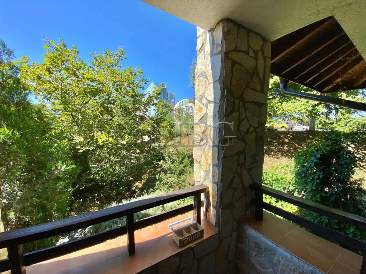 Bright balcony overlooking lush greenery in Sveti Vlas.