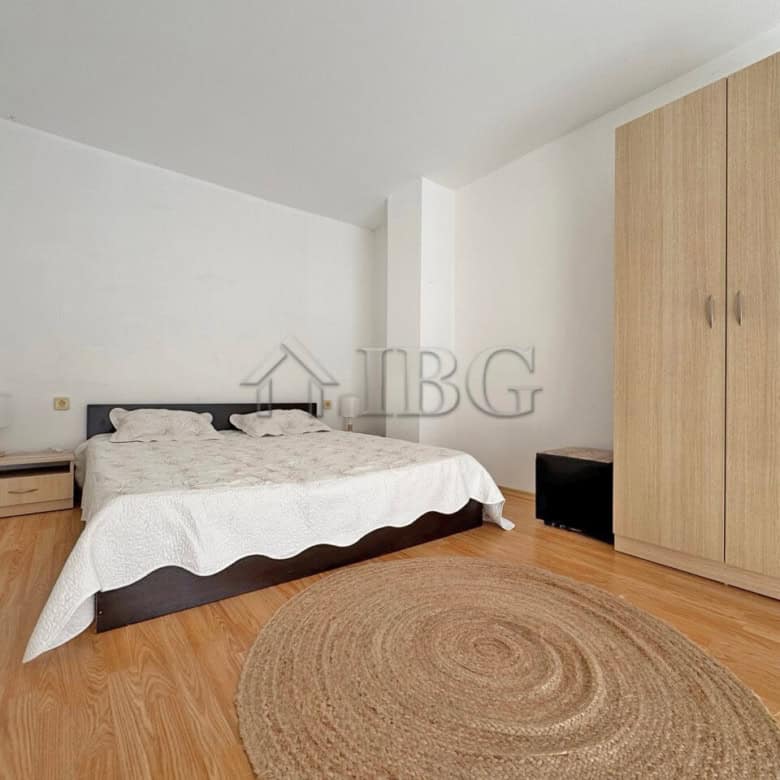 Bright bedroom with double bed and wooden furniture in Gerber Residence 3, Sunny Beach.