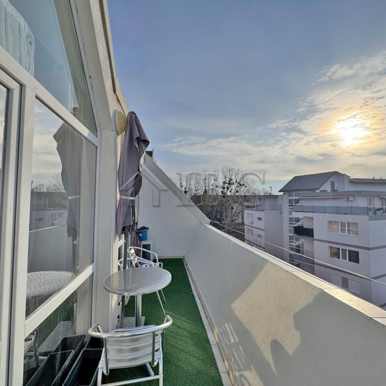 Balcony of a two-bedroom duplex apartment with outdoor seating in Sunny Beach.