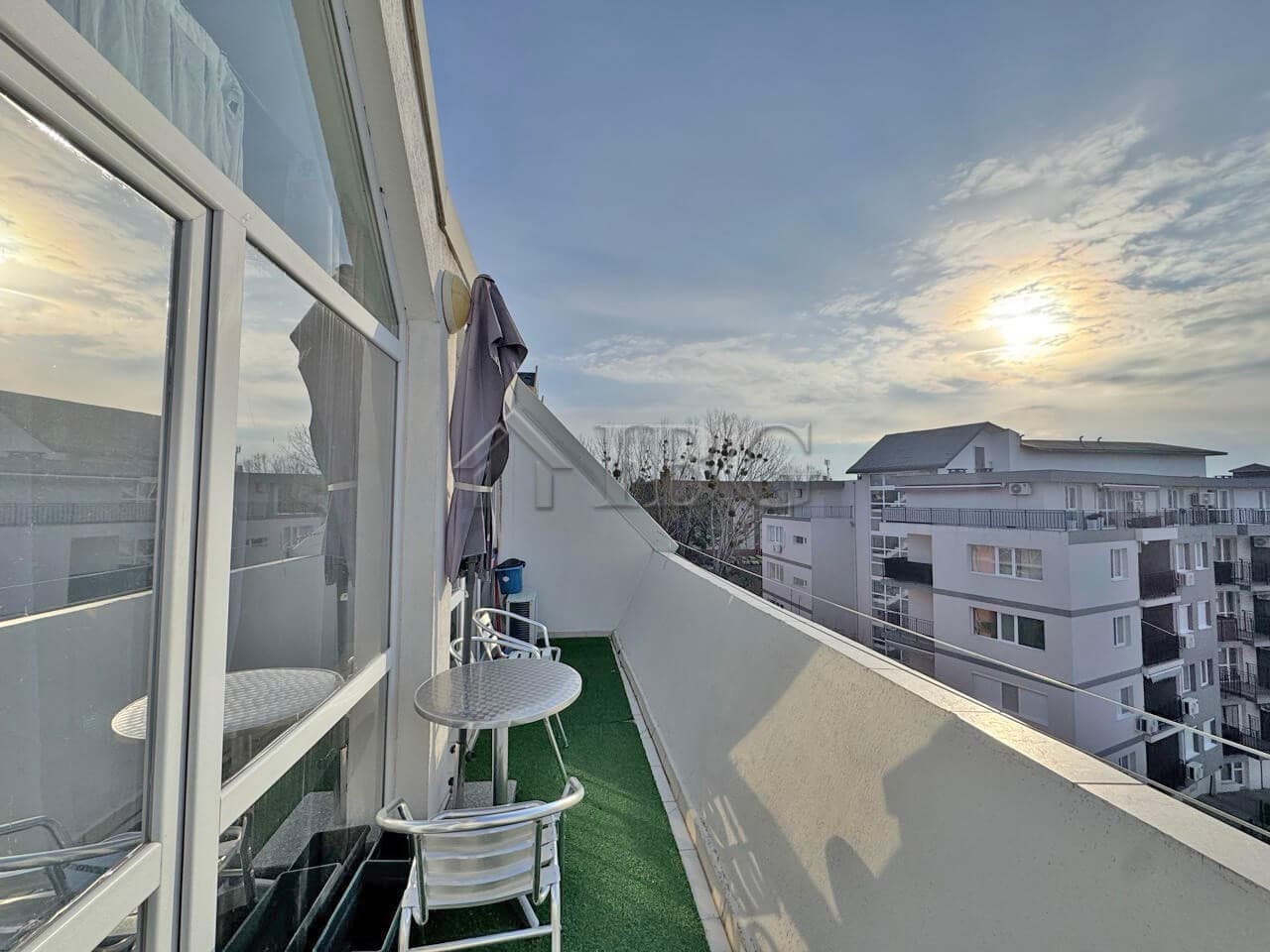 Balcony of a two-bedroom duplex apartment with outdoor seating in Sunny Beach.