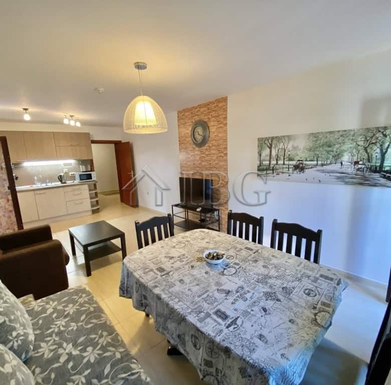 Spacious apartment living room with dining table, sofa, and modern decor in Sveti Vlas.