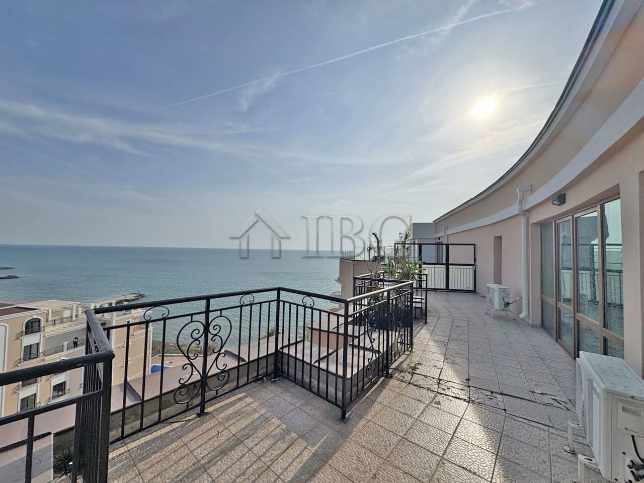 Spacious balcony of a beachfront 1-bedroom apartment with ocean views at Grand Hotel Sveti Vlas.