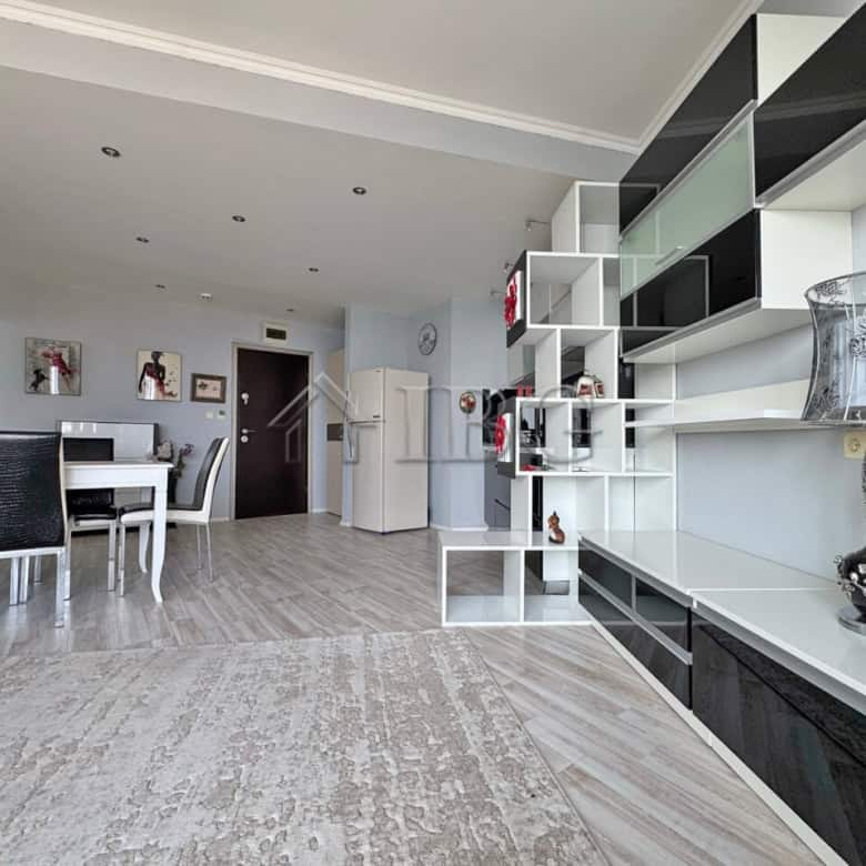 Beachfront 1-bedroom apartment with modern furnishings and open-plan living space.