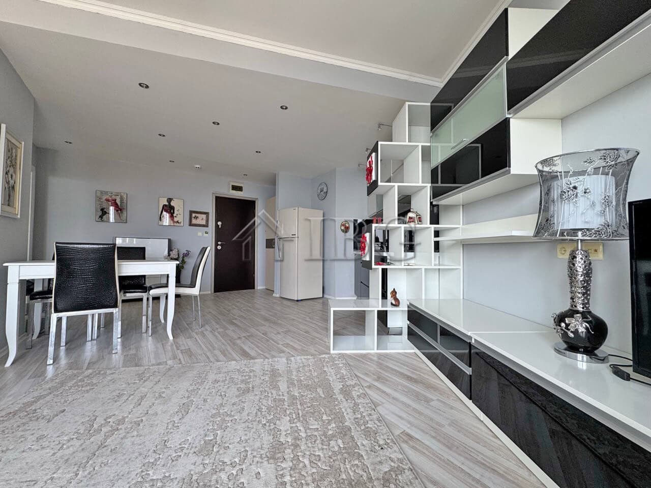 Beachfront 1-bedroom apartment with modern furnishings and open-plan living space.