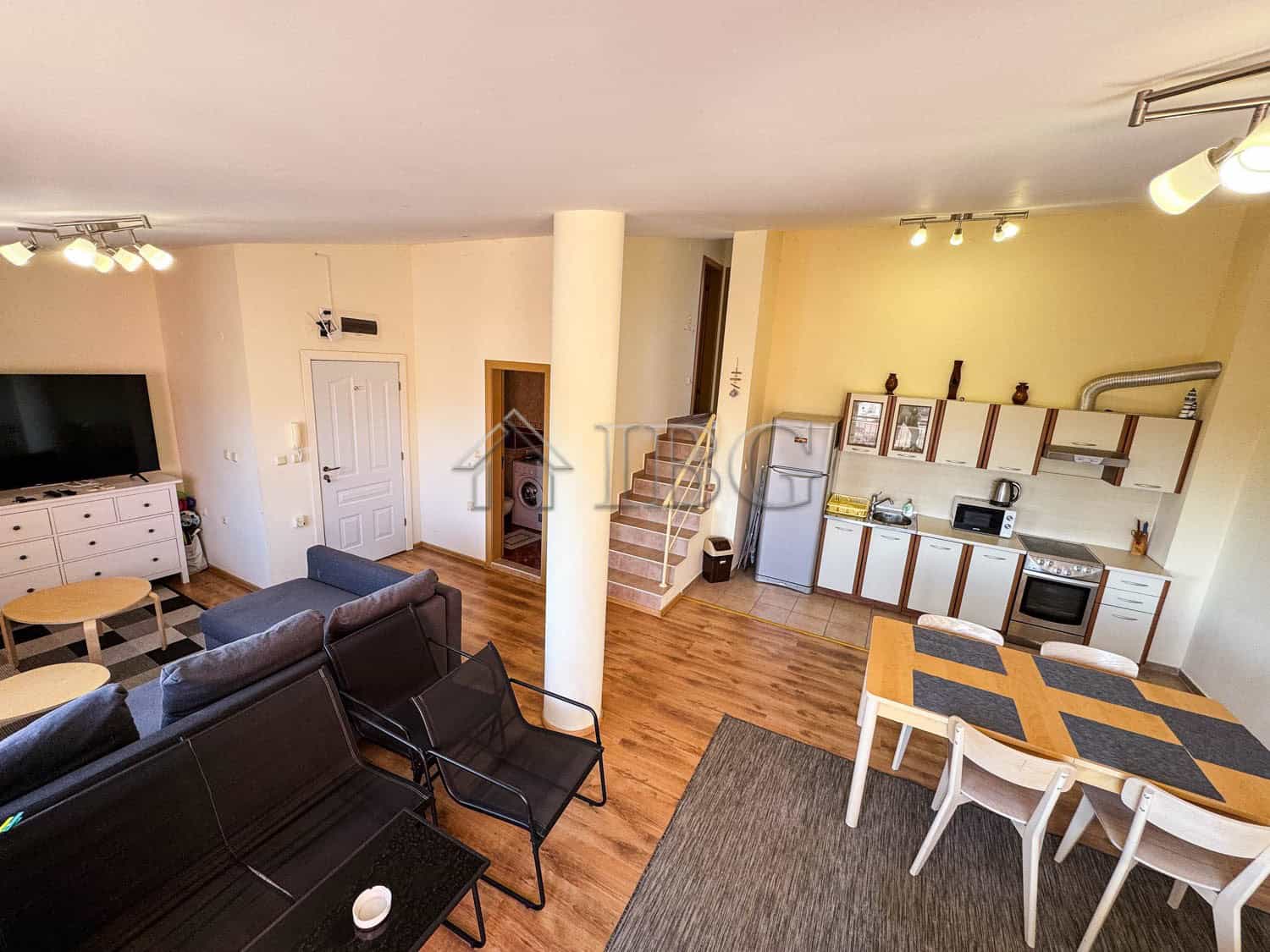 Spacious apartment with sea view, modern decor, and open living space in Sunny Beach.