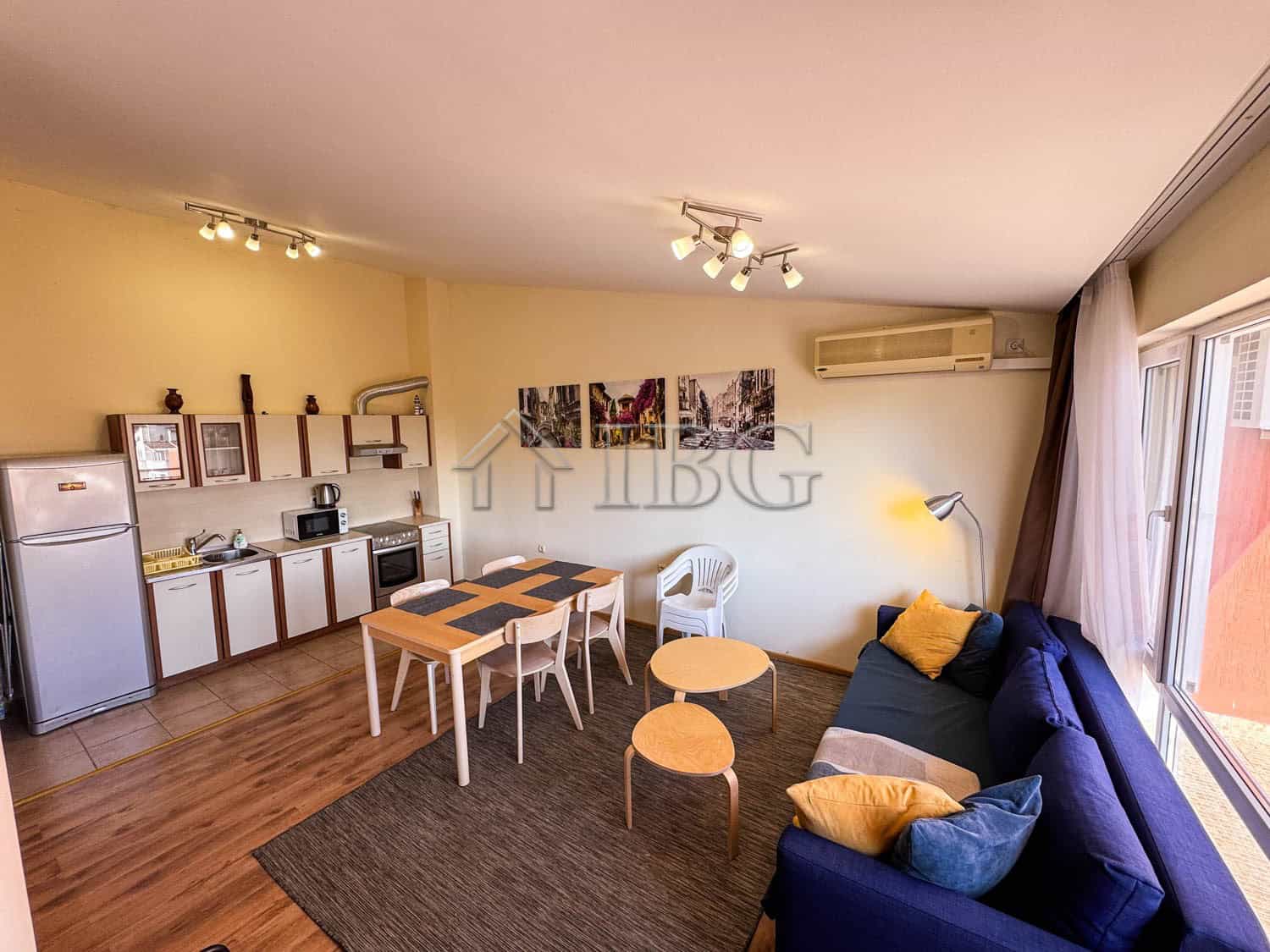 Modern 2-bedroom apartment with sea view, open-plan kitchen, and cozy living area in Sunny Beach.