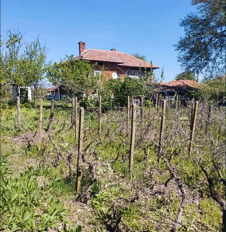 Two-storey house with a large garden in a peaceful village setting. Ideal for family living and outd.