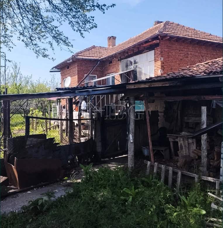 Two-storey brick house with large garden and outdoor storage area. Prime edge-of-village location of.