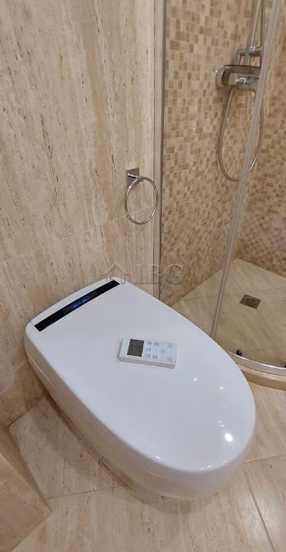 Elegant bathroom featuring a shower and toilet in a high-end Sveti Vlas apartment.