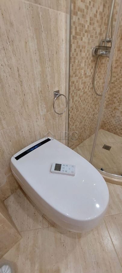 Elegant bathroom featuring a shower and toilet in a high-end Sveti Vlas apartment.