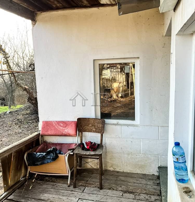 Outdoor porch with chairs and water bottle in Brestovitsa village, Ruse area.