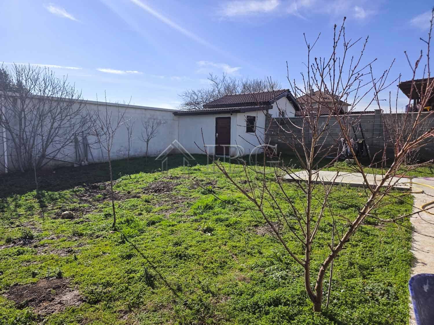 Spacious garden with young trees and pathway near detached house, 7 km from Sunny Beach.