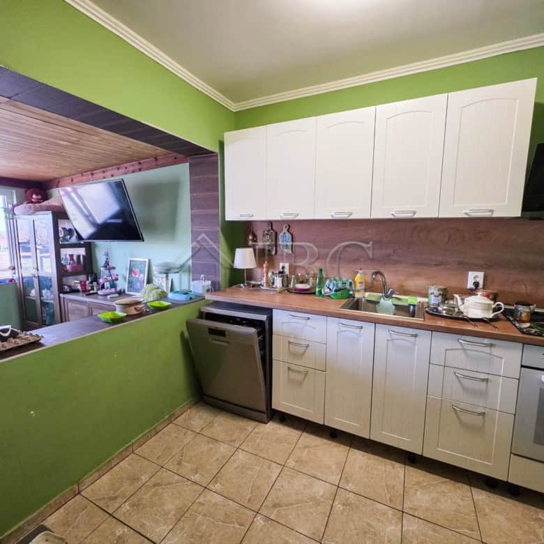 Bright kitchen with white cabinets and modern appliances, perfect for family living close to Sunny B.