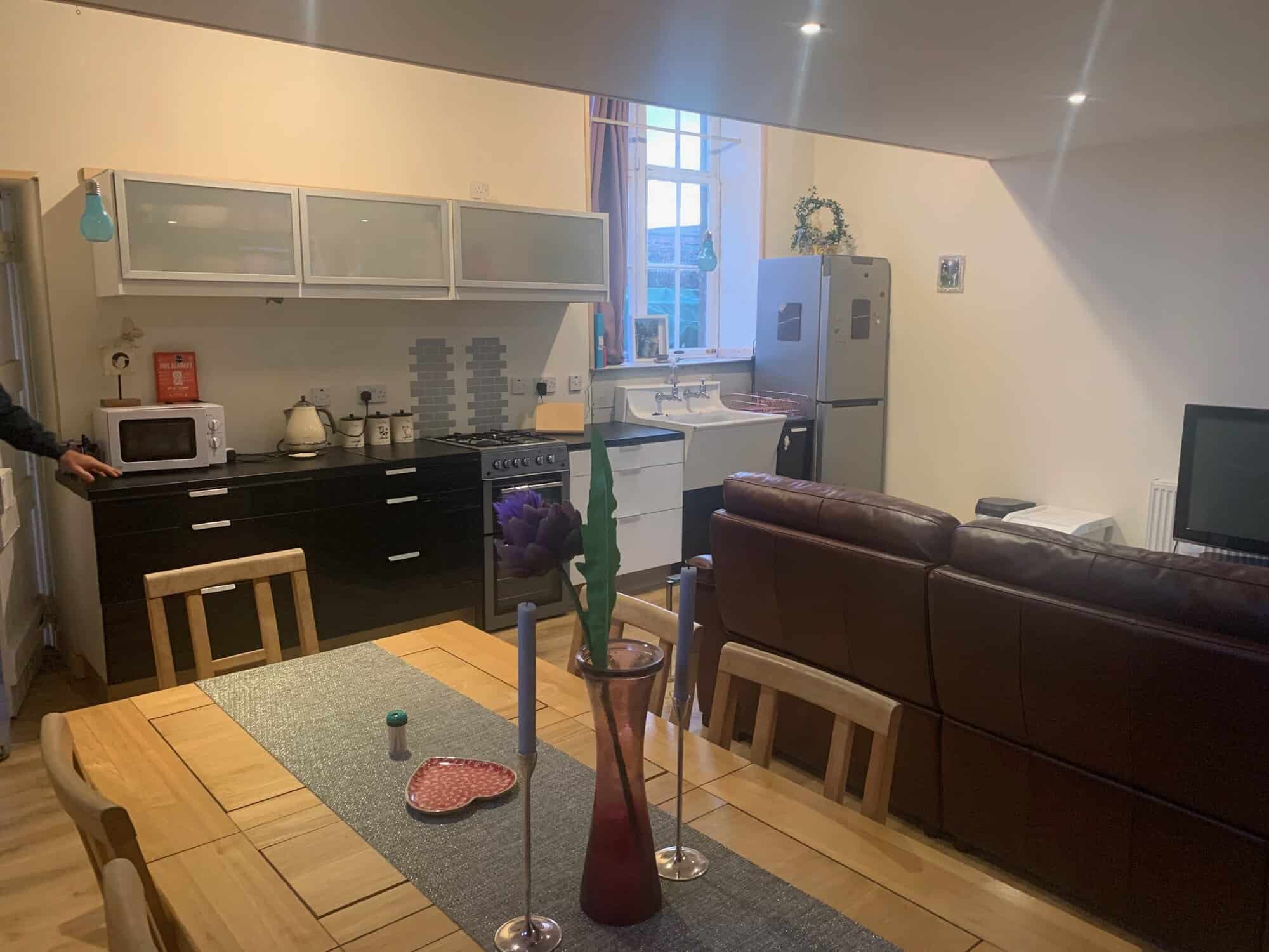 Interior view of a modern kitchen and living area in Mooncoin apartments, Kilkenny, Ireland.