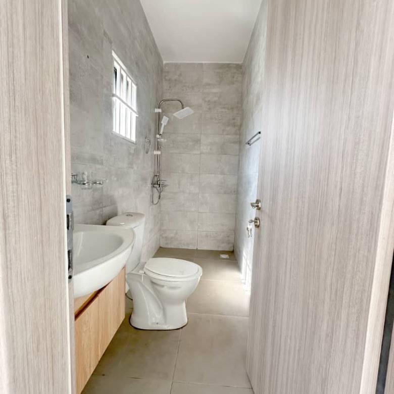 Bright bathroom with modern fixtures in a luxury villa in Brufut Gardens Estate, Gambia.