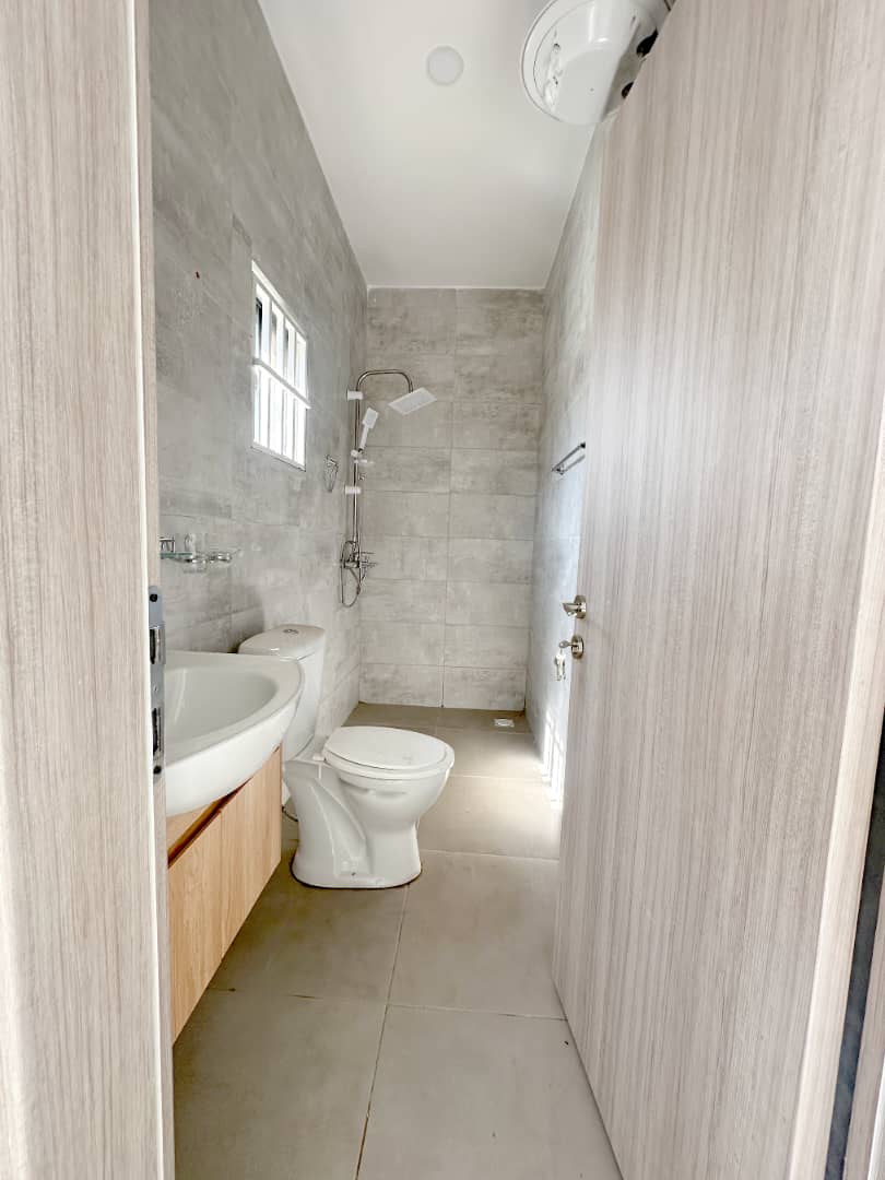 Luxury 3 Bed Villa For Sale in Brufut Gardens Estate Gambia Bright bathroom with modern fixtures in a luxury villa in Brufut Gardens Estate, Gambia.