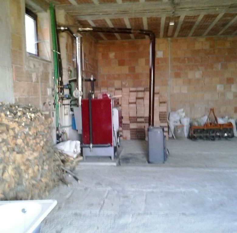 Spacious interior of a 3-bedroom house in Orsara di Puglia, Italy, under construction with exposed b.