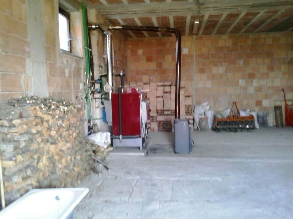Spacious interior of a 3-bedroom house in Orsara di Puglia, Italy, under construction with exposed b.