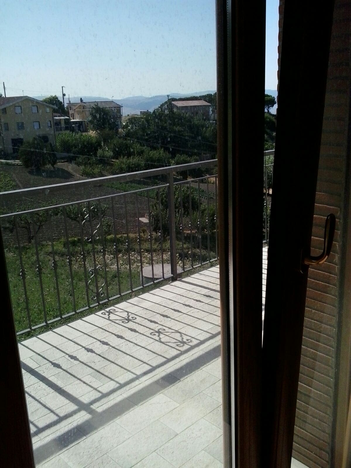 Bright view from balcony of a 3-bedroom house in Orsara di Puglia, Italy, with scenic countryside an.