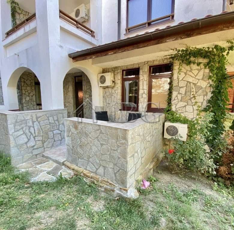 Exterior view of a spacious apartment with a large terrace and stone facade in Sveti Vlas.