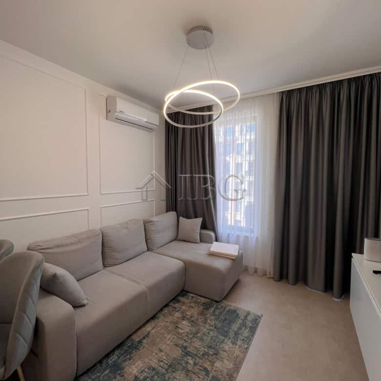 Cozy living room in a modern one-bedroom apartment with pool views at Polar Star, Sveti Vlas.