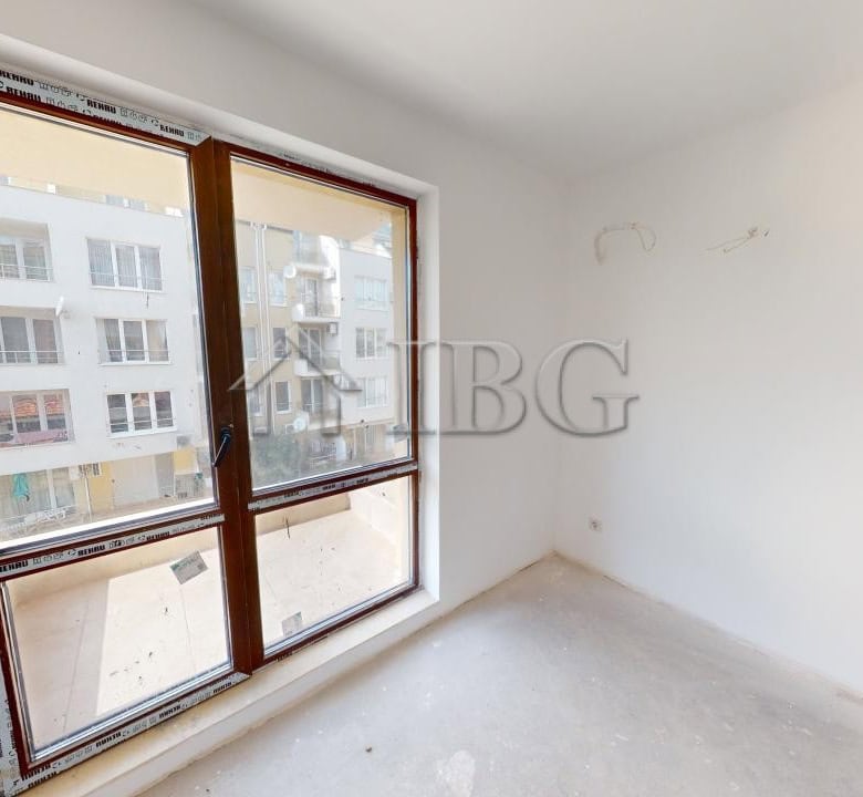 Sea view bedroom window in Ravda apartment for sale.