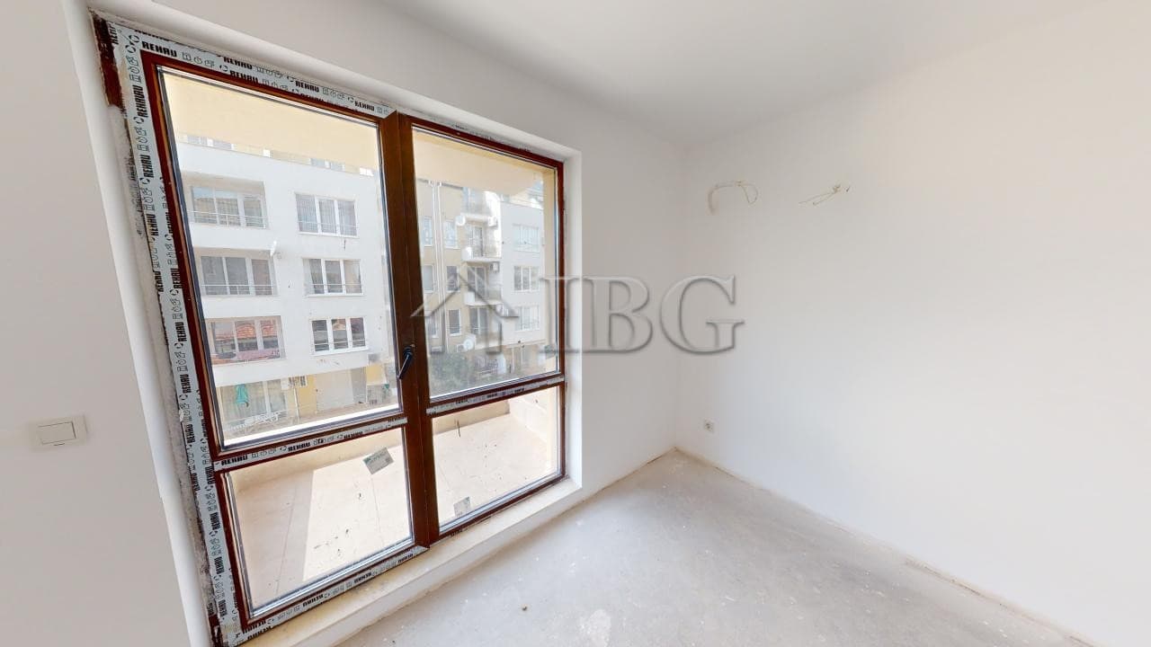 Sea view bedroom window in Ravda apartment for sale.