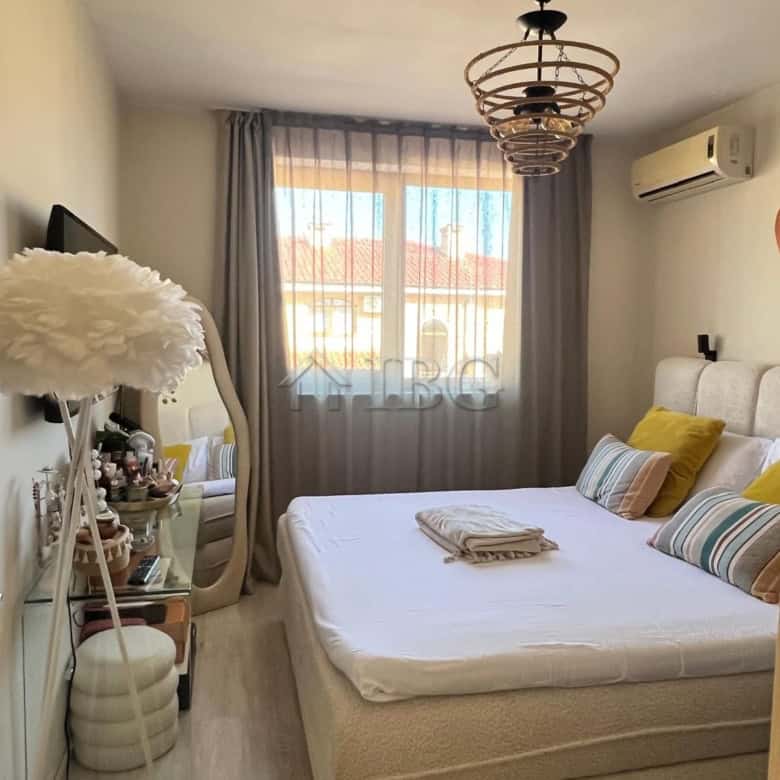 Bright bedroom with pool and partial sea view in Sveti Vlas apartment.