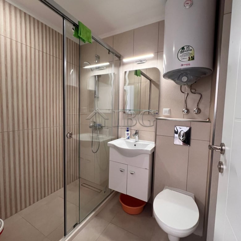 Compact bathroom with shower, sink, and toilet in Polar Star, Sveti Vlas.