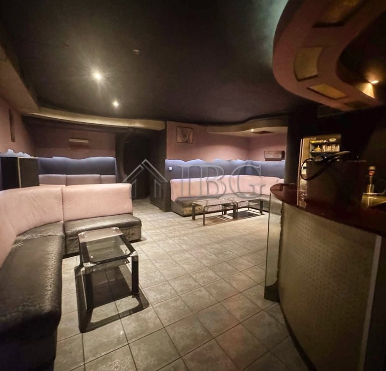 Spacious commercial premises featuring comfortable seating, perfect for a ready-to-operate business.