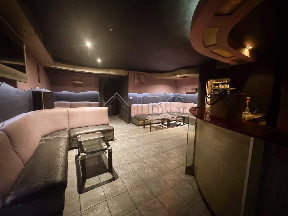 Spacious commercial premises featuring comfortable seating, perfect for a ready-to-operate business.