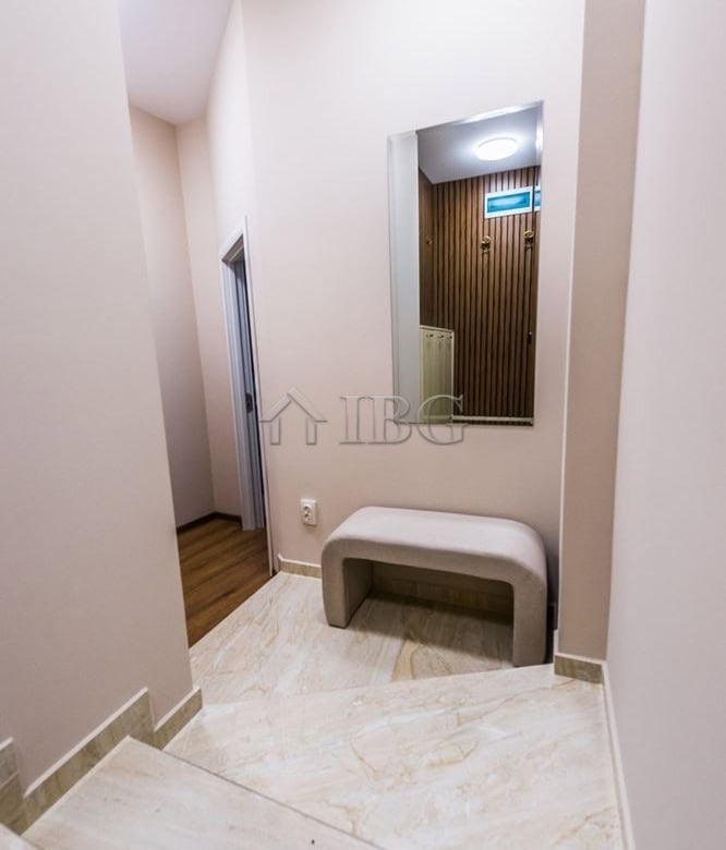 Modern apartment entrance with mirror and bench in Lazur District, Burgas.