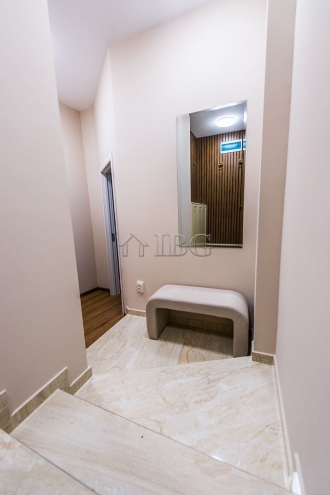 Modern apartment entrance with mirror and bench in Lazur District, Burgas.