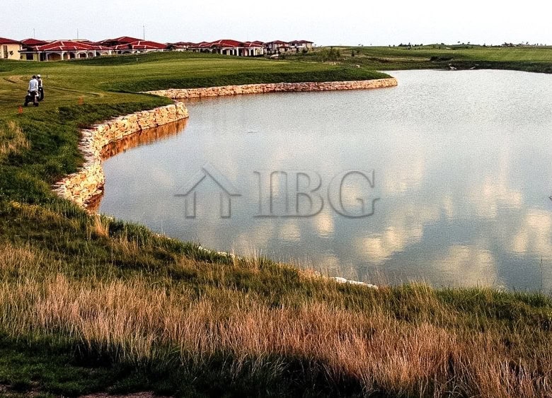 View of a golf course and water feature at Lighthouse Golf & Spa Resort.