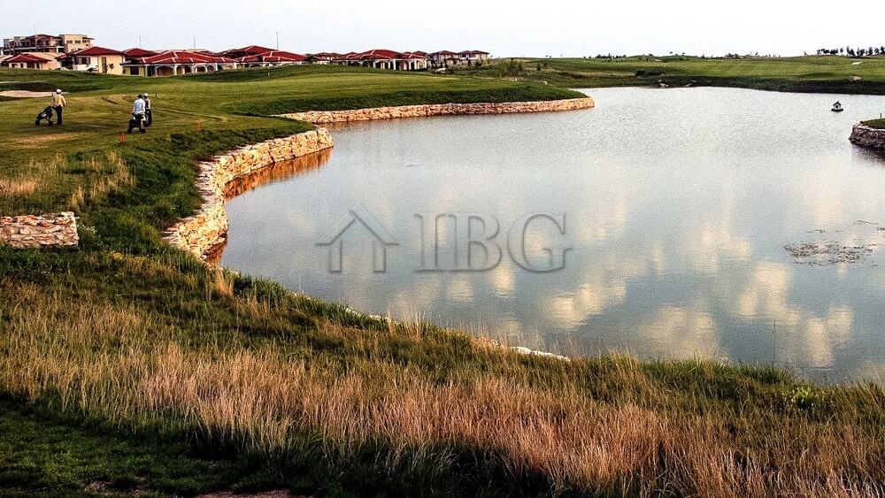 View of a golf course and water feature at Lighthouse Golf & Spa Resort.